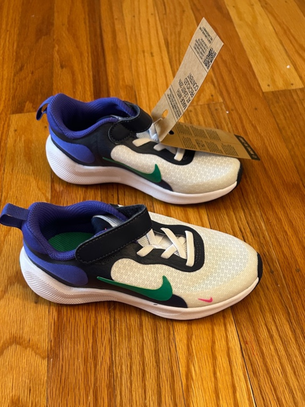 Nike Kids White Sneakers with Purple and Green Accents